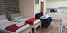 An image labelled 3 x single beds and 1 x pull out bed. With private Jacuzzi :)