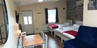 An image labelled Apt with balcony/jacuzzi (505). 3 single beds and 1x pull out bed. Sleeps 4.