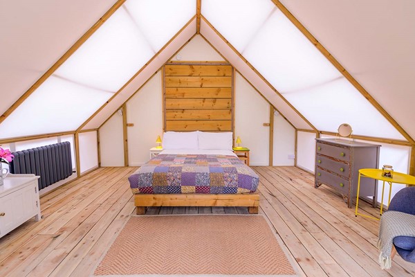 An image labelled Romantic Glamping Suite