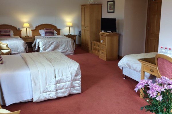 An image labelled 4 Bed Suite Room
