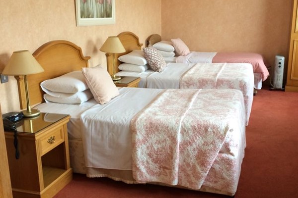 An image labelled 3 Bed Suite Room