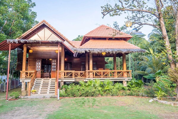 An image labelled Wooden House Villa