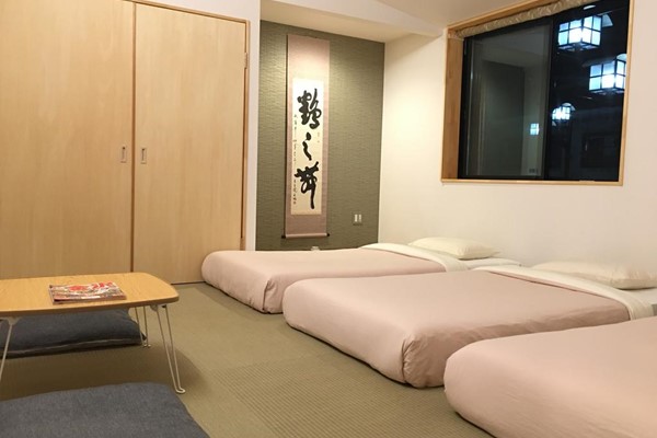 An image labelled Quad Standard Japanese Style Room
