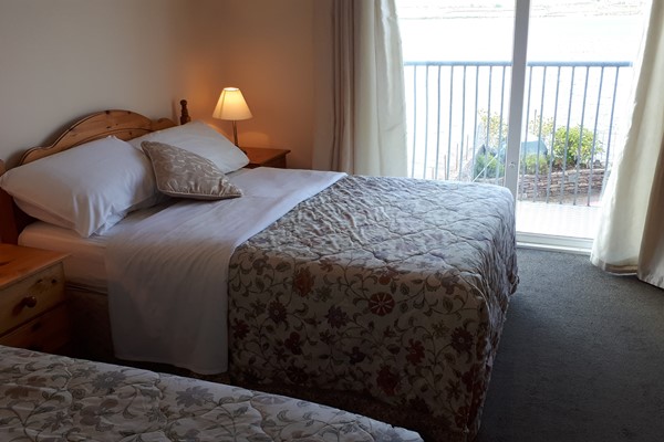 An image labelled Double and Single Seaview Room