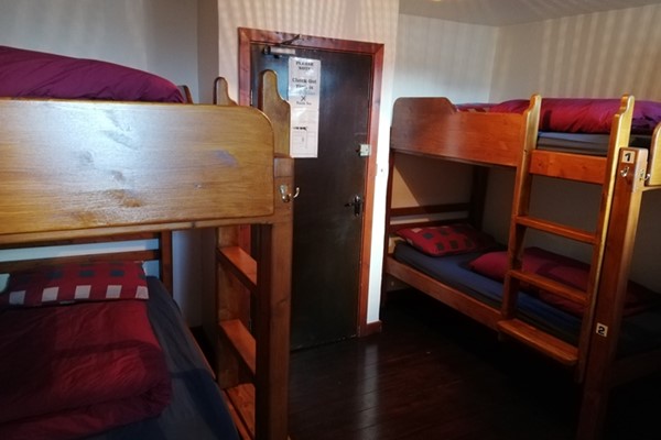 An image labelled Quad ( 2 sets bunk beds) Room