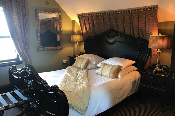 An image labelled Deluxe Double Room