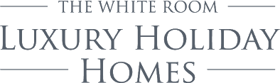 An image labelled Kenmare Luxury Holiday Homes - The White Room Logo