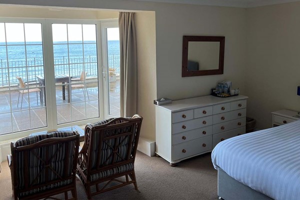 An image labelled Deluxe Double Room with Sea View and Balcony Room
