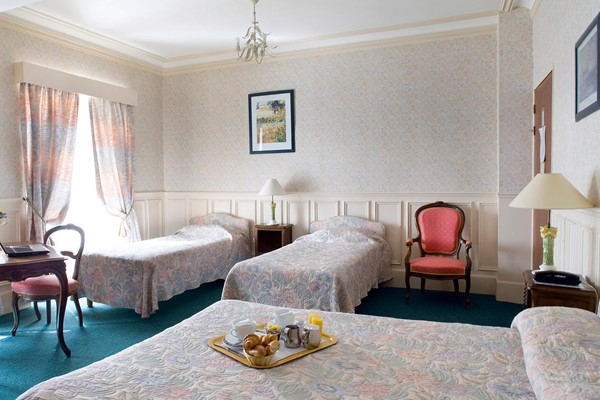 An image labelled 1 Doubles - 2 Singles Family Suite Room